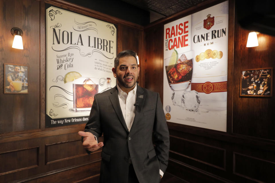 Miguel Solorzano, Sazerac House general manager, gives an introduction during a media preview for the Sazerac house, in New Orleans, Tuesday, Sept. 10, 2019. Visitors to New Orleans who want to learn more about cocktails will soon have a new place to go. No, it's not another bar. The Sazerac House is a six-story building on the city's famed Canal Street owned by the Sazerac Company, a Louisiana-based spirits maker, featuring the signature New Orleans drink called the Sazerac. Tasting is encouraged, and in addition to free samples given to visitors, there will also be special classes and tastings offered daily. (AP Photo/Gerald Herbert)