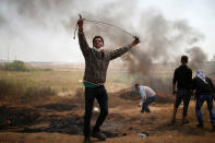 <p>A Palestinian demonstrator shouts during clashes with Israeli troops at a protest demanding the right to return to their homeland, at the Israel-Gaza border east of Gaza City April 6, 2018. (Photo: Mohammed Salem/Reuters) </p>