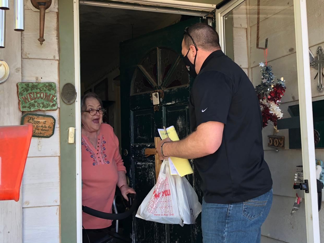 San Angelo resident, Joyce Kvapil, is ecstatic as Nick George of H-E-B tells her he is dropping of her Thanksgiving meal donated by Meals for the Elderly as shown in this 2020 file photo.