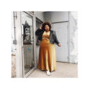 <p>Take your velour gown from night to day by pairing it with a classic moto jacket and casual Converse sneakers to dress down the look. (Photo: Courtesy of @itsmekellieb) </p>