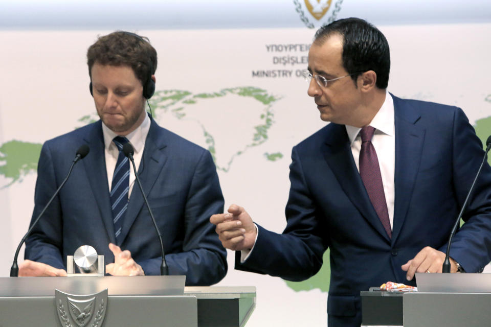 France's Minister for European Affairs Clement Beaune, left, and Cyprus' Foreign Minister Nikos Christodoulides take part in a news conference at the Foreign Ministry building in the capital Nicosia, Friday, Sept. 18, 2020. Beaune says the European Union should consider imposing sanctions against Turkey if the country continues a hydrocarbons search inside waters where Greece and Cyprus claims exclusive rights. (AP Photo/Petros Karadjias)