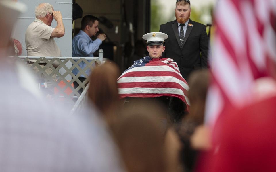 His owner fought back tears - Credit: Joel Bissell/Muskegon Chronicle via AP