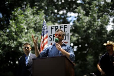 Mike Cernovich speaks during a rally about free speech outside of the White House in Washington, U.S., June 25, 2017. REUTERS/Carlos Barria