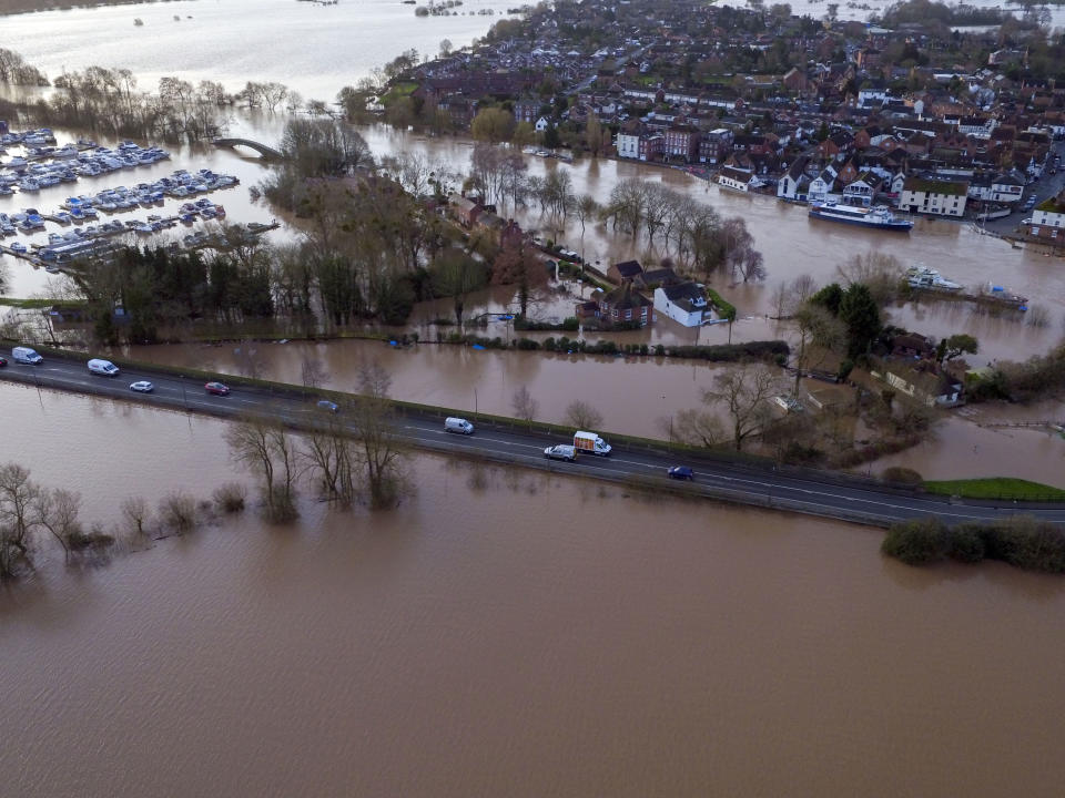 Flood water surrounds Upton upon Severn, England, Tuesday Feb. 18, 2020. Britain's Environment Agency issued severe flood warnings Monday, advising of life-threatening danger after Storm Dennis dumped weeks' worth of rain in some places. (Steve Parsons/PA via AP)