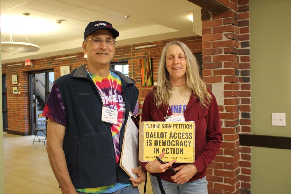 Gary and Susan Ulin, from Deerfield, NH, help to gather signatures for RFK Jr. at a rally in Kittery, ME on Thursday, May 30.