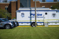 Police respond to the scene of a shooting at Heritage High School in Newport News, Va., on Saturday Sept. 20, 2021. Newport News police Chief Steve Drew said two students were shot and taken to the hospital and neither injury was thought to be life-threatening. The chief said authorities believe the suspect and victims knew one another but did not provide details. (AP Photo/John C. Clark)