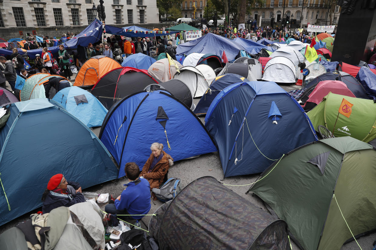 A general view of the pop up tents used by climate change protesters on Whitehall in London, Tuesday, Oct. 8, 2019.Police are reporting they have arrested more than 300 people at the start of two weeks of protests as the Extinction Rebellion group attempts to draw attention to global warming .(AP Photo/Alastair Grant)