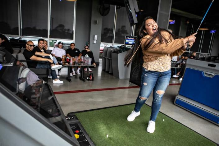 EL SEGUNDO, CA - JUNE 15: Brianna Casas and her coworkers from Knott's Berry Farms enjoy an evening of entertainment at the Southland's new Topgolf on Wednesday, June 15, 2022 in El Segundo, CA. (Jason Armond / Los Angeles Times)