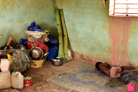 A newly displaced child from Dablo, sleeps on a mat inside a house in the city of Kaya, Burkina Faso May 16, 2019. REUTERS/Anne Mimault