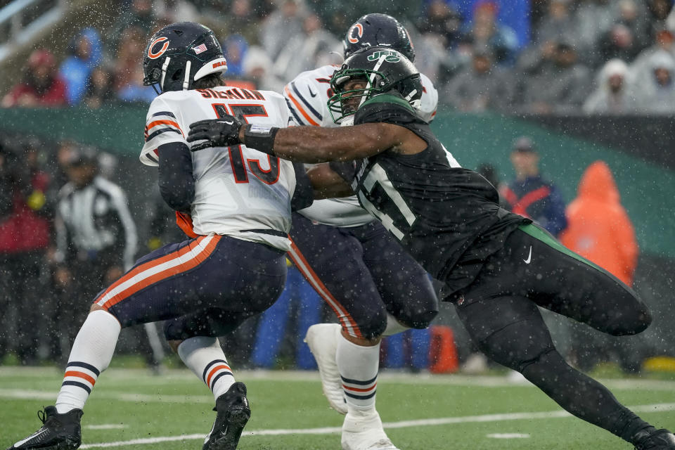 New York Jets defensive end Bryce Huff (47) sacks Chicago Bears quarterback Trevor Siemian (15) during the third quarter of an NFL football game, Sunday, Nov. 27, 2022, in East Rutherford, N.J. (AP Photo/John Minchillo)