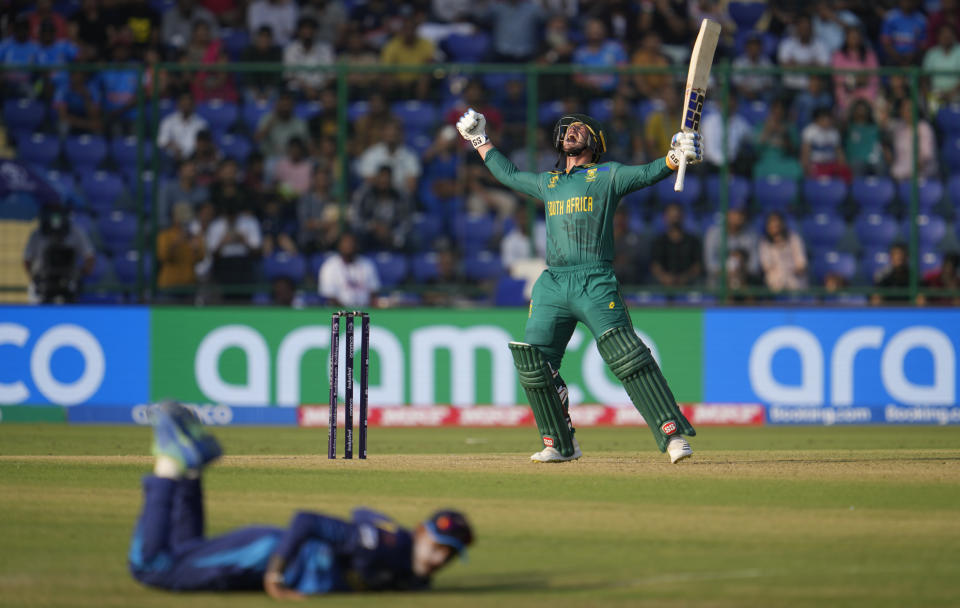 South Africa's Quinton De Kock celebrates after scoring a century during the ICC Cricket World Cup match between South Africa and Sri Lanka in New Delhi, India, Saturday, Oct. 7, 2023. (AP Photo/Altaf Qadri)