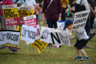 <p>A child walks around anti-Trump signs in Edinburgh during a visit by the president to Scotland on July 14, 2018. Trump, meanwhile, was at his Turnberry Luxury Collection Resort on Scotland’s west coast. (Photo: Jeff J. Mitchell/Getty Images) </p>