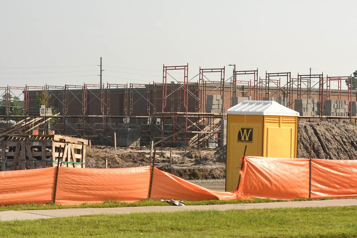 Construction continues on many of the new businesses growing up around the Leland Town Center on Wednesday June 28, 2023. A new Lowes, 7-Eleven and car wash are just a few of the new sites under construction.  [KEN BLEVINS/STARNEWS]