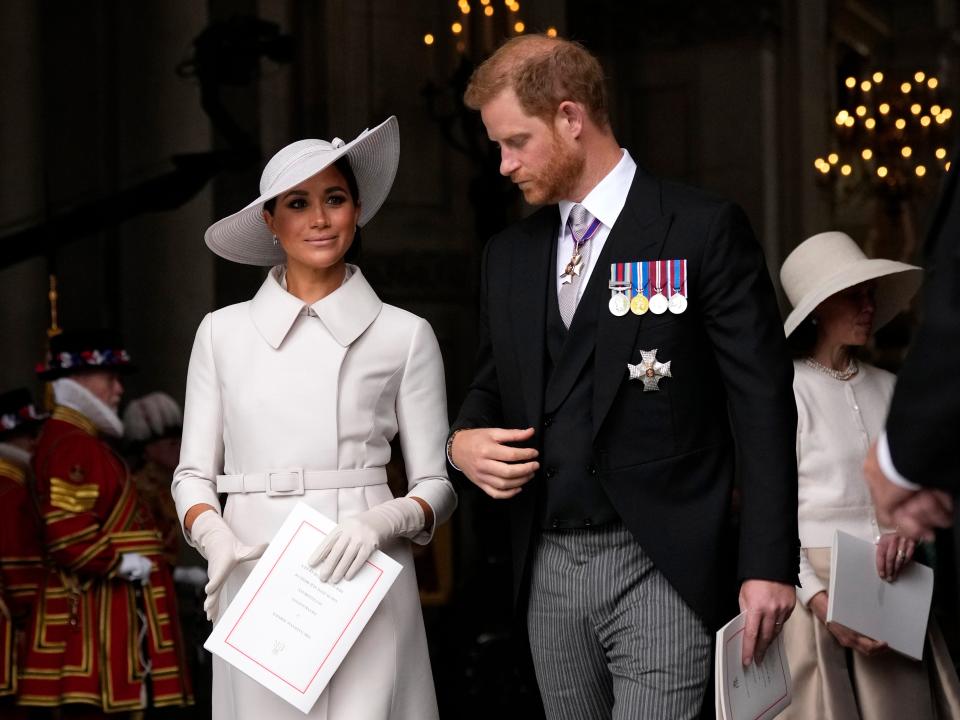 prince harry and meghan markle attending a service celebrating queen elizabeth's platinum jubilee