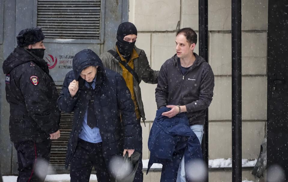 FILE - Wall Street Journal reporter Evan Gershkovich, right, is escorted from court in Moscow, Russia, on Friday, Jan. 26, 2024. Gershkovich, 32, was arrested by Russian authorities in March 2023 and accused of espionage – charges that he, his employer and the U.S. government deny. (AP Photo/Alexander Zemlianichenko, File)