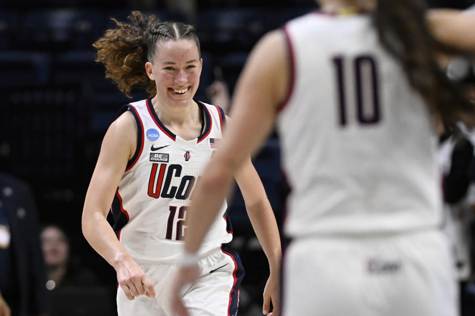 UConn guard Ashlynn Shade (12) reacts in the first half of a first-round college basketball game in the NCAA Tournament, Saturday, March 23, 2024, in Storrs, Conn. (AP Photo/Jessica Hill)