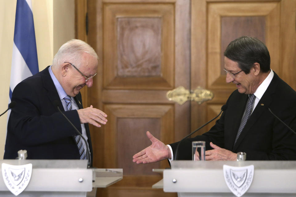 Cyprus' president Nicos Anastasiades, right, shakes hands with Israel's President Reuven Rivlin after their meeting at the presidential palace in divided capital Nicosia, Cyprus, on Tuesday, Feb. 12, 2019. Rivlin is in Cyprus for a one-day official visit for talks. (AP Photo/Petros Karadjias)