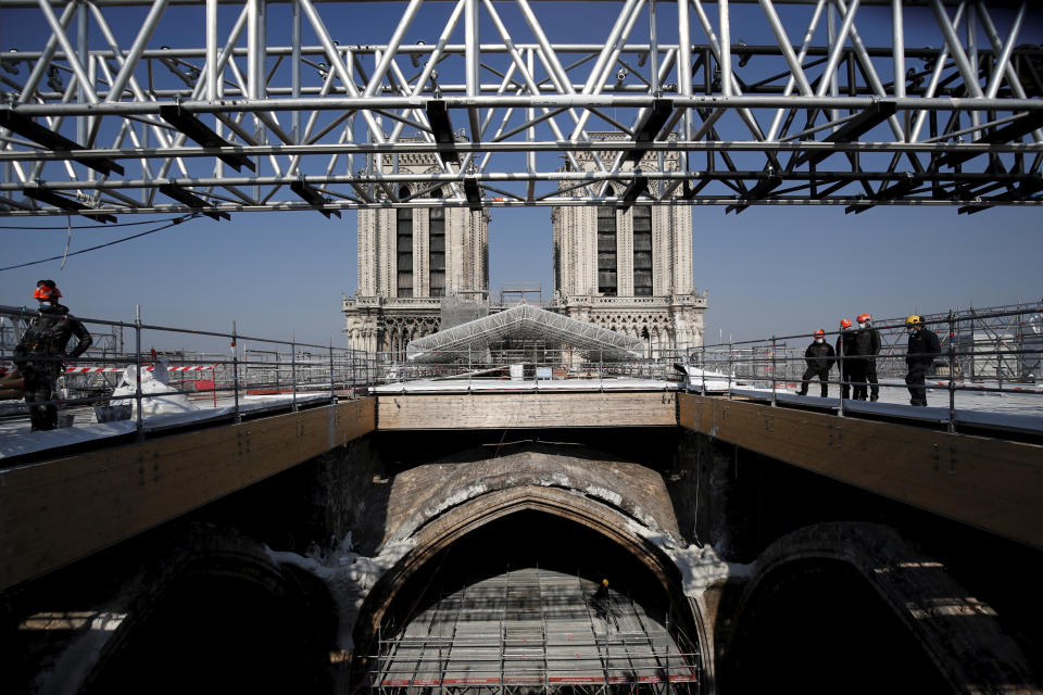 The reconstruction site of the Notre-Dame cathedral is pictured Thursday, April 15, 2021 in Paris. Two years after a fire tore through Paris' most famous cathedral and shocked the world, French President Emmanuel Macron is visiting the building site that Notre Dame has become Thursday to show that French heritage has not been forgotten despite the coronavirus. (Benoit Tessier/Pool via AP)