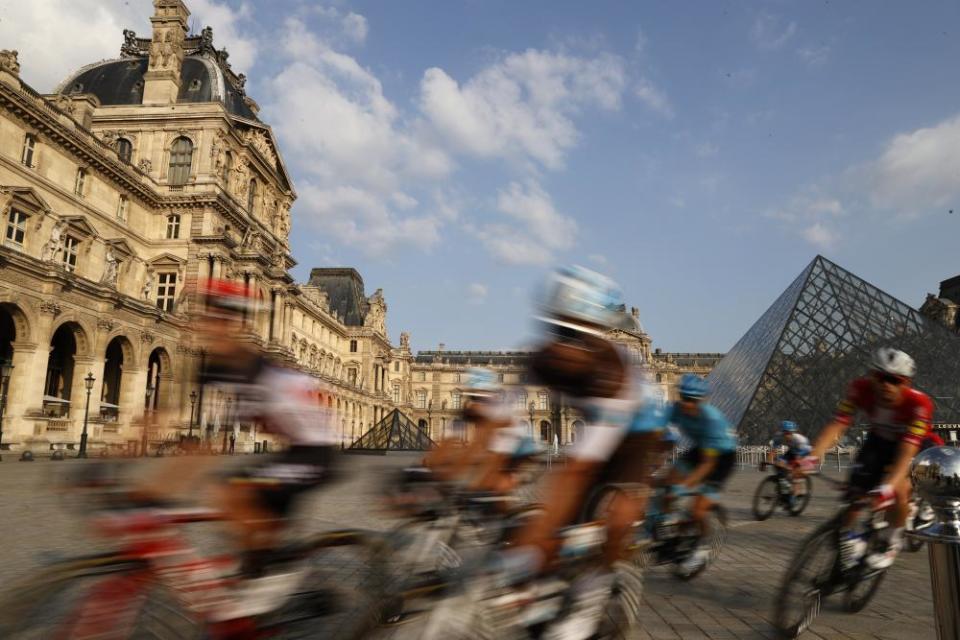 The pack rides through the courtyard of the Louvre Museum in Paris on the final stage between Mantes-la-Jolie and Paris.