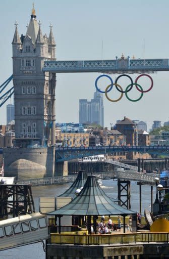 Olympics rings can be seen hanging from the tower bridge in London. In total, 18,200 soldiers are now helping to guard 10,500 competitors at the Games, alongside thousands of private guards and police