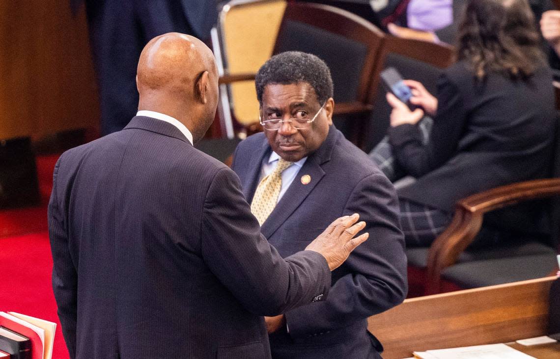 Democratic Reps. Shelly Willingham and Garland Pierce talk on the floor of the North Carolina House before the House convened for its afternoon voting session on Wednesday, May 3, 2022.