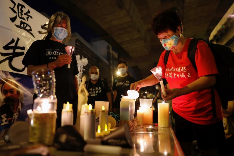 People attend a candlelight vigil ahead of the 31st anniversary of protests at Beijing's Tiananmen Square, in Hong Kong