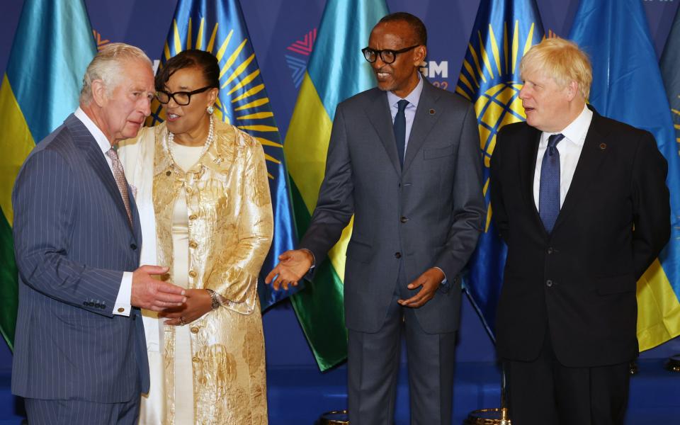 Prince Charles (L), Prince of Wales, arrives as secretary-general of the Commonwealth of Nations Patricia Scotland, Rwandan President Paul Kagame and British Prime Minister Boris Johnson prepare to greet him during the opening ceremony for the Commonwealth Heads of Government Meeting at Kigali Convention Centre  - Luke Dray/Getty Images Europe
