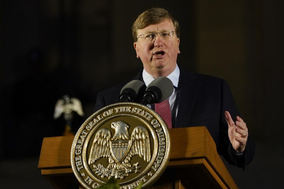 Gov. Tate Reeves at the microphone, at a podium marked: The Great Seal of the State of Mississippi.