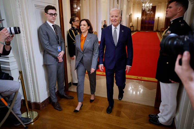 WASHINGTON, DC - OCTOBER 30: U.S. President Joe Biden and Vice President Kamala Harris arrive for an event about their administration’s approach to artificial intelligence in the East Room of the White House on October 30, 2023 in Washington, DC. 