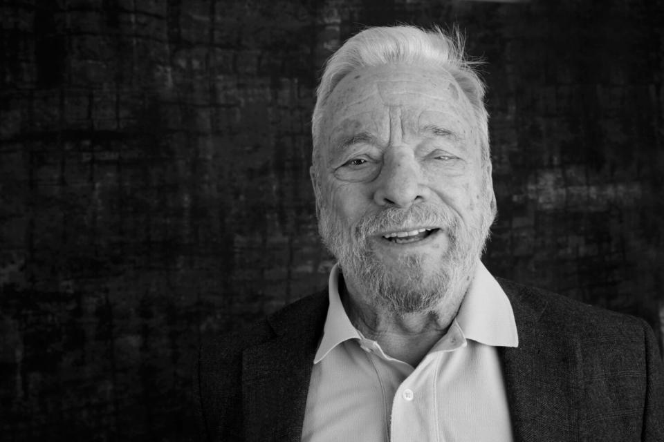 Stephen Sondheim smiles at the camera.