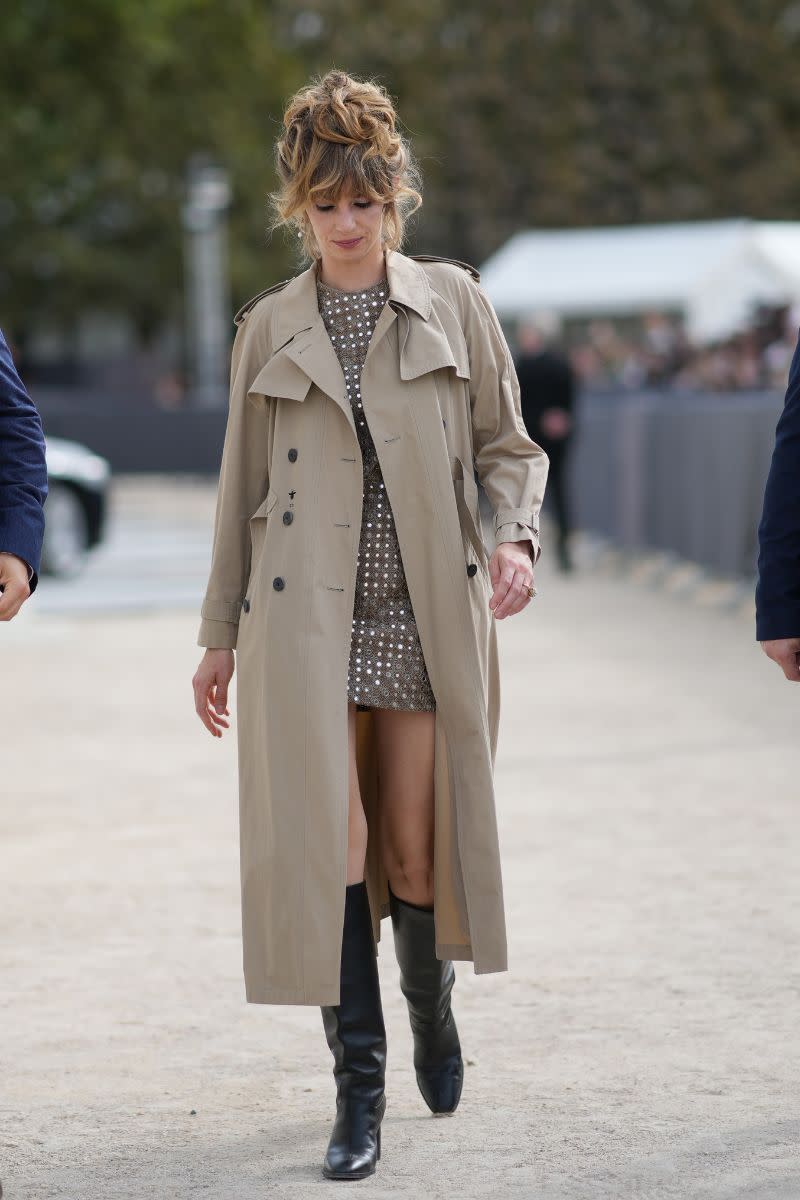 <p> While sequin and embellished dresses may traditionally work best with court shoes or designer heels, they can also look equally as good with a pair of knee-high boots. Finish with a trench coat, like this street styler, for a Parisian feel or, for a more polished look, try a tailored maxi coat. </p>