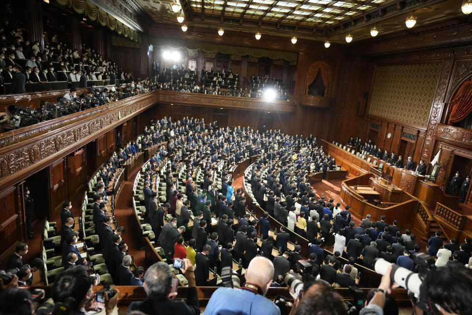 Lawmakers listen to the announcement of the dissolution of the lower house Thursday, Oct. 14, 2021, in Tokyo. Japan’s new Prime Minister Fumio Kishida dissolved the lower house of parliament Thursday, paving the way for Oct. 31 national elections.(AP Photo/Eugene Hoshiko)