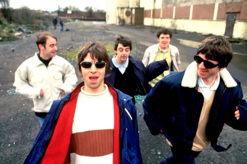 Portrait of Oasis taken in Glasgow on 7th April 1994. (From left to right) Paul 'Bonehead' Arthurs, Liam Gallagher, Paul McGuigan, Tony McCarroll and Noel Gallagher. -Credit: Steve Double / Retna UK.