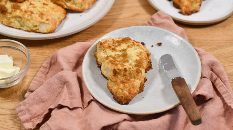 scone with butter on a plate