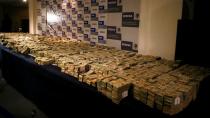 FILE PHOTO: Seized bundles of cash are displayed for the media in Mexico City