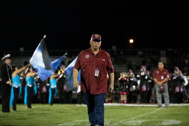 PHOTO: Carlos 'Charlie' Ramos of the 1972 championship Uvalde football team takes the field on Sept 2, 2022. (Kat Caulderwood/ABC News)