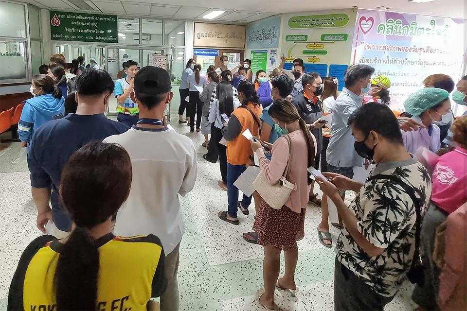 Residents line up to donate blood a the local hospital for victims of an attack at a day care center on Thursday in the town of Nong Bua Lamphu, northeastern Thailand. More than 30 people, primarily children, were killed Thursday when a gunman opened fire in the child care center, authorities said.