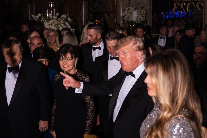 Former President Donald Trump and his wife, Melania Trump, are seen inside the Mar-A-Lago ballroom on New Years Eve on 2022.