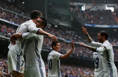 Football Soccer- Spanish La Liga Santander - Real Madrid v Valencia- Santiago Bernabeu Stadium, Madrid, Spain - 29/04/17 - Real Madrid's Cristiano Ronaldo celebrates scoring with teammate Carlos Henrique Casemiro. REUTERS/Susana Vera