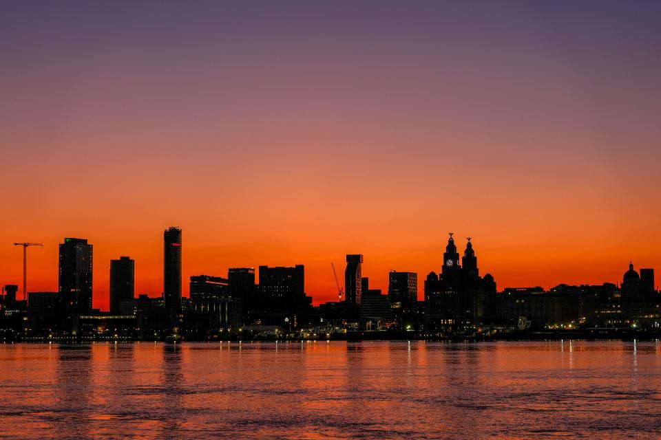 The sun rises over the River Mersey in Liverpool. Highs of up to 31C have been forecast for this week as temperatures across the UK continue to rise. Picture date: Monday June 24, 2024.