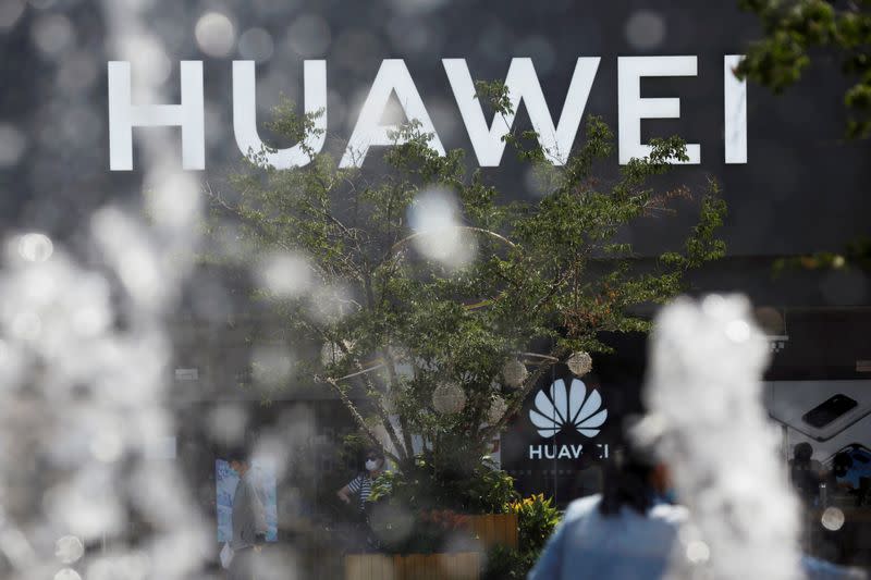 FILE PHOTO: Huawei sign is seen on its store at a shopping complex in Beijing