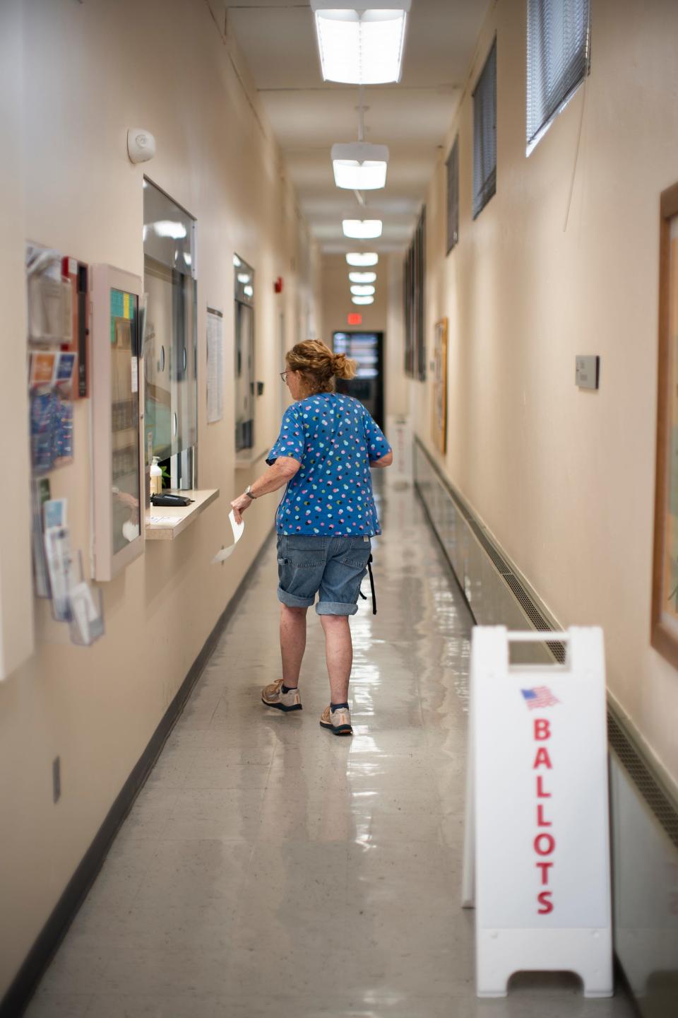Barbara Earth, of Athens, takes her ballot to vote on Issue 1 during early voting at the Athens County Board of Elections on July 28. She said Issue 1 backers are misleading voters into thinking Issue 1 is democratic − and she doesn't think it is.