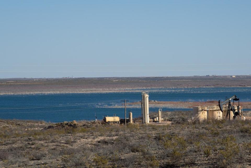 An oil drilling operation on the banks of the Red Bluff Reservoir in Reeves County, Texas on May 27, 2020. NGL Water Solutions Permian has proposed to discharge treated produced water into the reservoir.