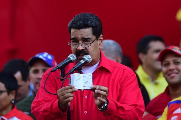 Venezuelan President Nicolas Maduro calls the economic crisis a capitalist conspiracy, while the opposition blames his economic management (AFP Photo/Ronaldo Schemidt)