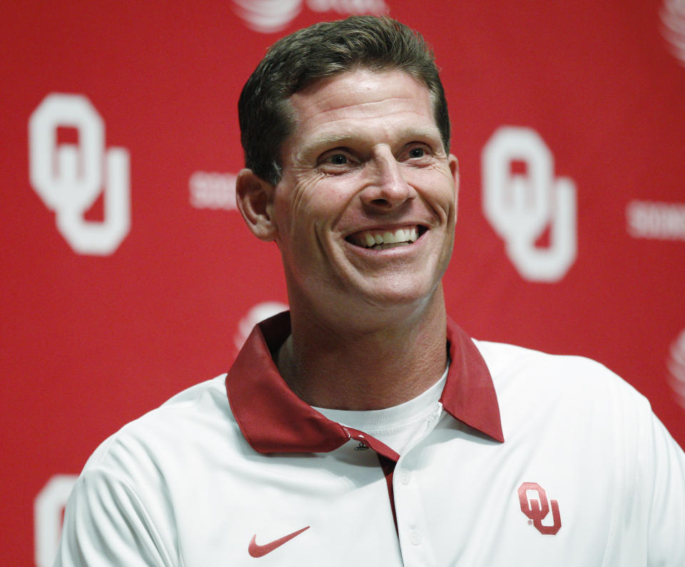 FILE - Brent Venables, Oklahoma associate head coach/defensive coordinator/linebackers, is pictured during Oklahoma football media day in Norman, Okla., Saturday, Aug. 6, 2011. A person with knowledge of the situation tells The Associated Press that Oklahoma is targeting Clemson defensive coordinator Brent Venables to be its new head coach. (AP Photo/Sue Ogrocki, File)