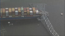 Parts of the Francis Scott Key Bridge remain after a container ship collided with one of the bridge’s support Tuesday, March 26, 2024 in Baltimore. The major bridge in Baltimore snapped and collapsed after a container ship rammed into it early Tuesday, and several vehicles fell into the river below. Rescuers were searching for multiple people in the water. (WJLA via AP)