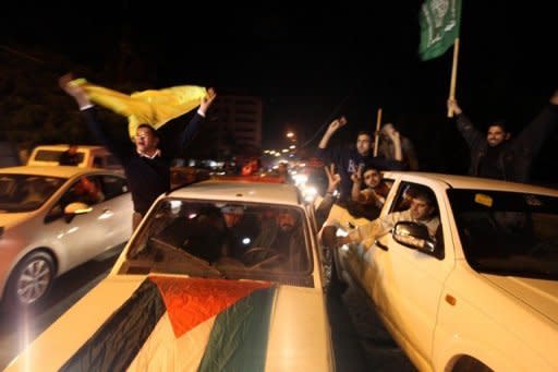 Palestinian supporters of Hamas and Fatah celebrate together in Gaza City early on November 30, 2012. The UN General Assembly has overwhelmingly voted to make Palestine a non-member state, inflicting a major diplomatic defeat on the United States and Israel