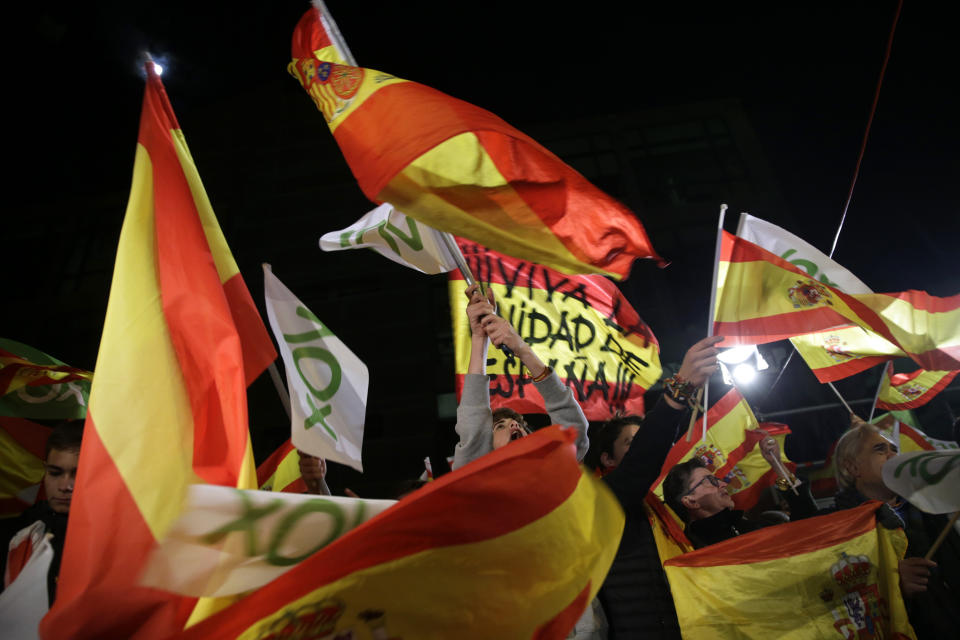 Spain's far-right Vox party supporters cheer after the announcement of the general election first results, in Madrid, Spain, Sunday, Nov. 10, 2019. Spain's Interior Ministry says that early results show Socialists winning Spain's national election, but without a clear end to the country's political deadlock. Vox is also surging to become the country's third political force, more than doubling its presence in the parliament's lower house from 24 to 53 deputies only six months after its debut. (AP Photo/Andrea Comas)