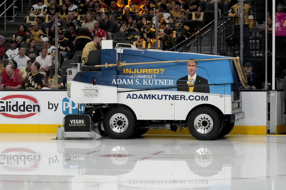 An ice resurfacer is used between periods during Game 2 of the NHL hockey Stanley Cup Finals between the Florida Panthers and the Vegas Golden Knights, Monday, June 5, 2023, in Las Vegas. Ice maintenance is generally the same across the league. Technicians work to make sure the ice — 1.25 to 1.5 inches thick — is the right temperature and consistency so that the puck slides smoothly and the players can slice along the ice with no problems. But with the Stanley Cup Final between the Las Vegas Golden Knights and Florida Panthers taking place in two of the hottest markets in the country in South Florida and Las Vegas, making sure outside conditions don't compromise the ice is an all-day process. (AP Photo/John Locher)