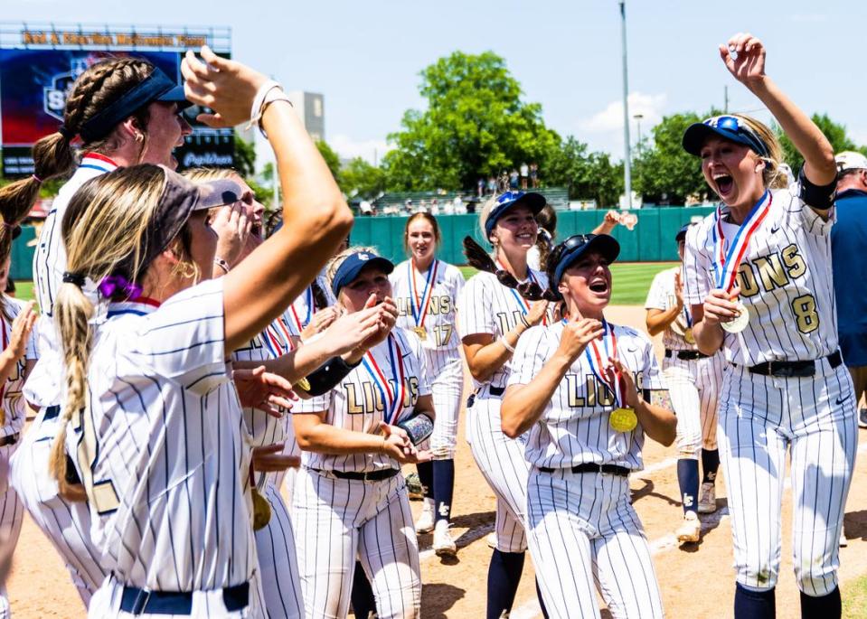 The Montgomery Lake Creek softball team celebrates with their medals after winning the Class 5A state championship over New Braunfels Canyon on Saturday, June 3, 2023, at McCombs Field in Austin, TX. Matthew Smith